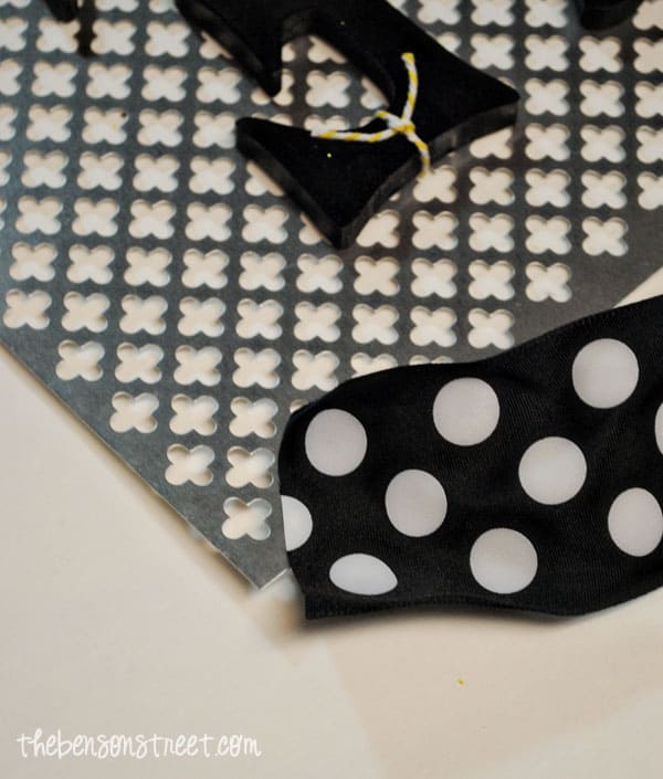 Adding ribbon to hang sign