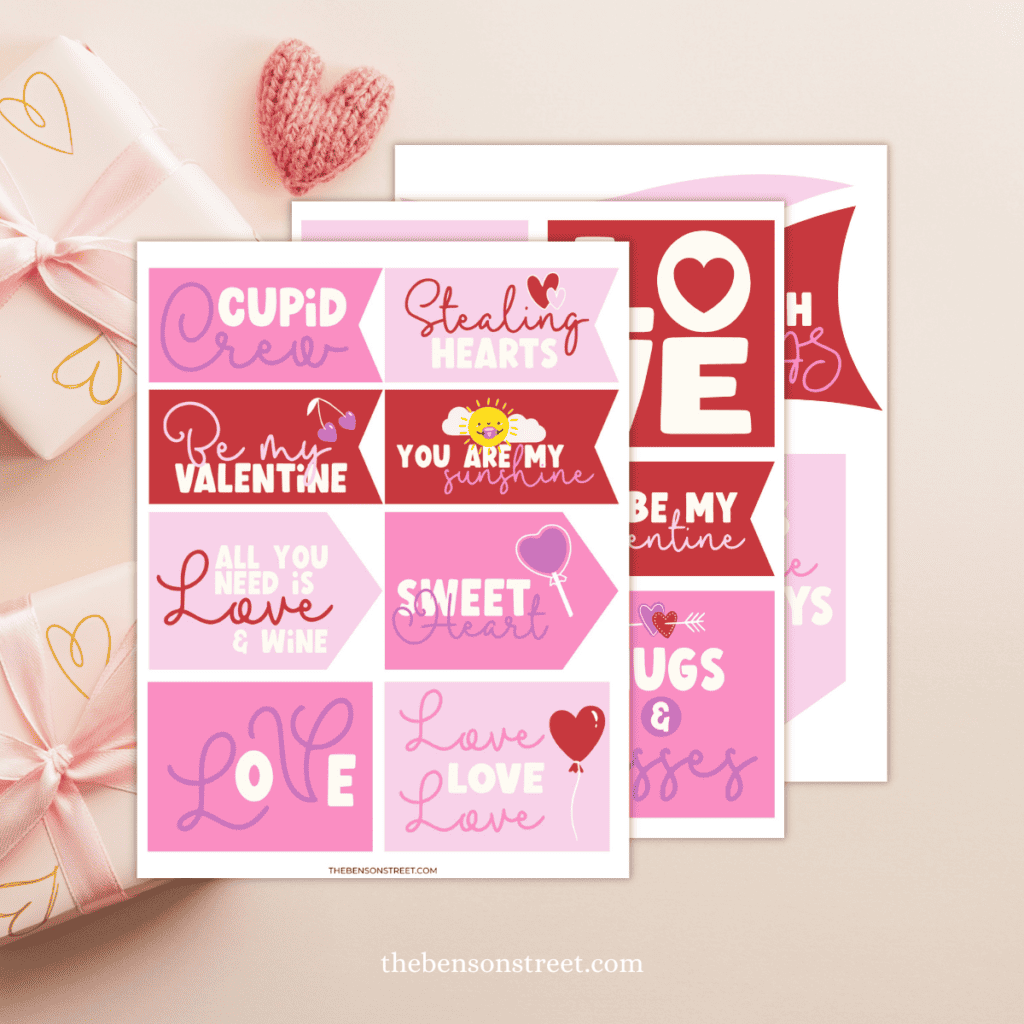 Three sheets of love and Valentine's Day tags stacked on top of each other.