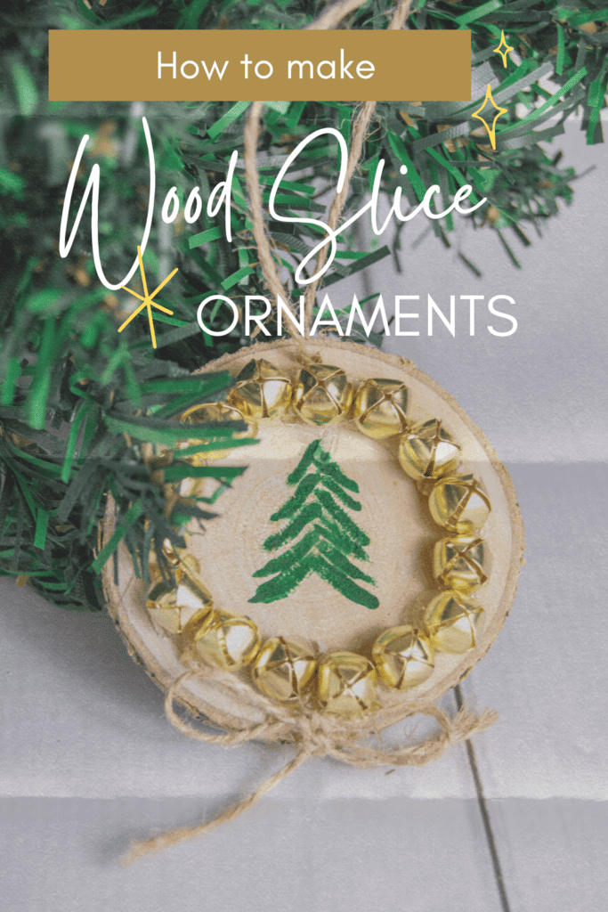 Decorate your tree with rustic charm with this simple DIY wood slice tree ornaments. Dress up the wood rounds with evergreen trees and bells for a festive dollar store craft.