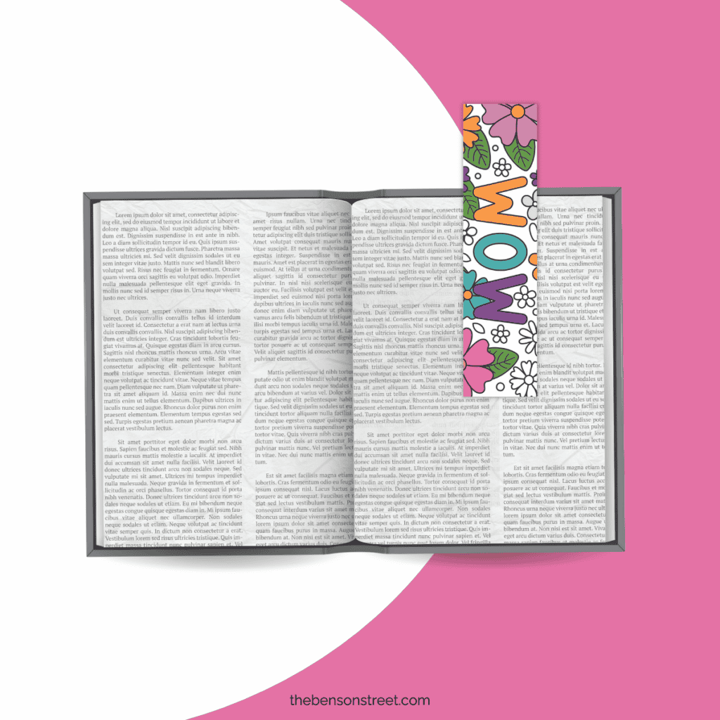 A close-up of a printed Mother's Day coloring bookmark being colored in with vibrant markers.