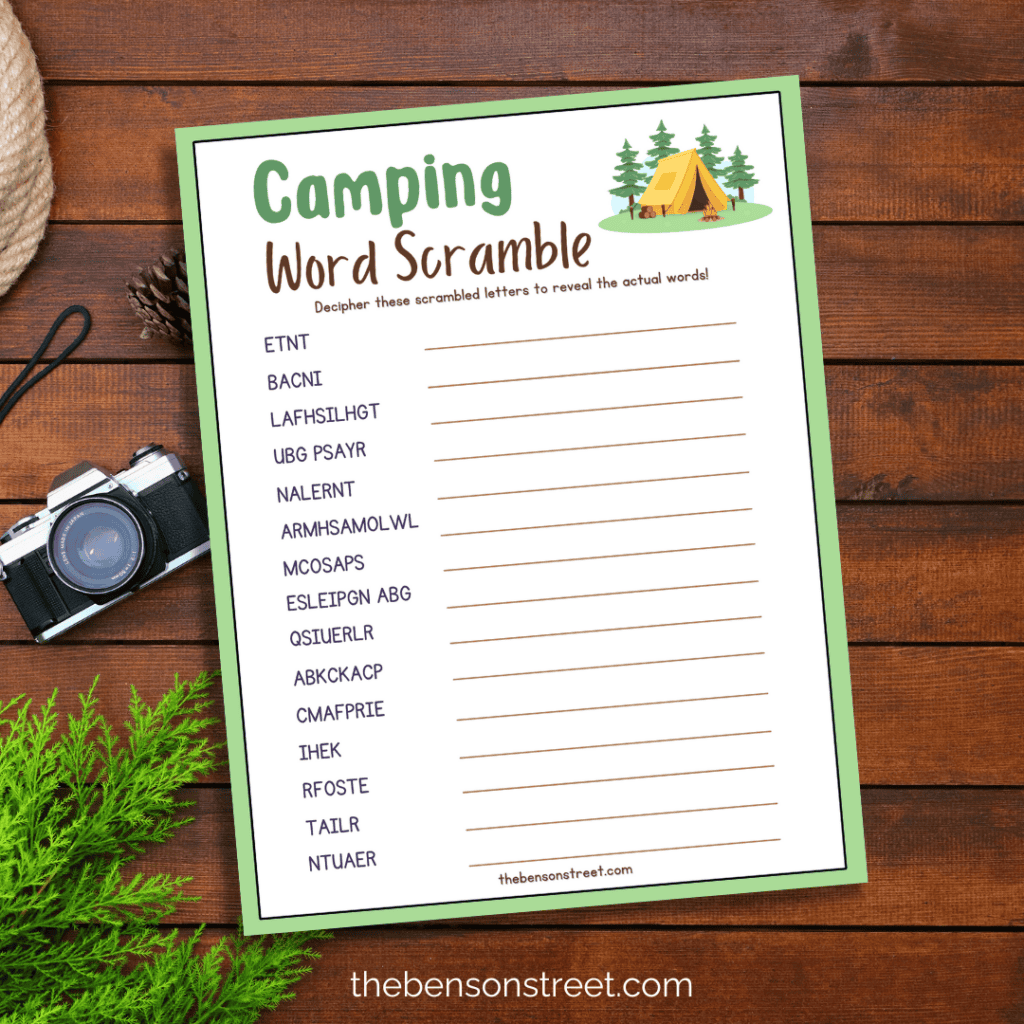 A top-down view of the worksheet placed on a wooden table, with camping supplies beside it, ready for use.