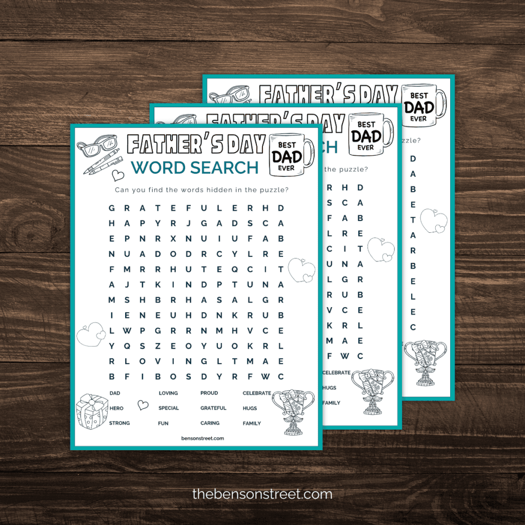Stack of printed Father's Day Word Search puzzles with a pen resting on top.