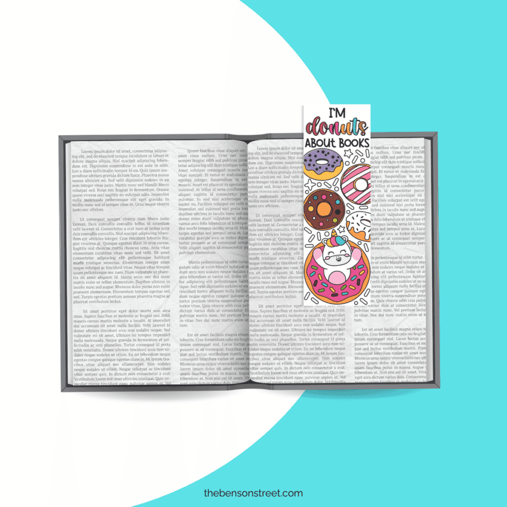 A colored in free printable coloring bookmark that says I'm donuts about books with a unicorn coming out of a donut