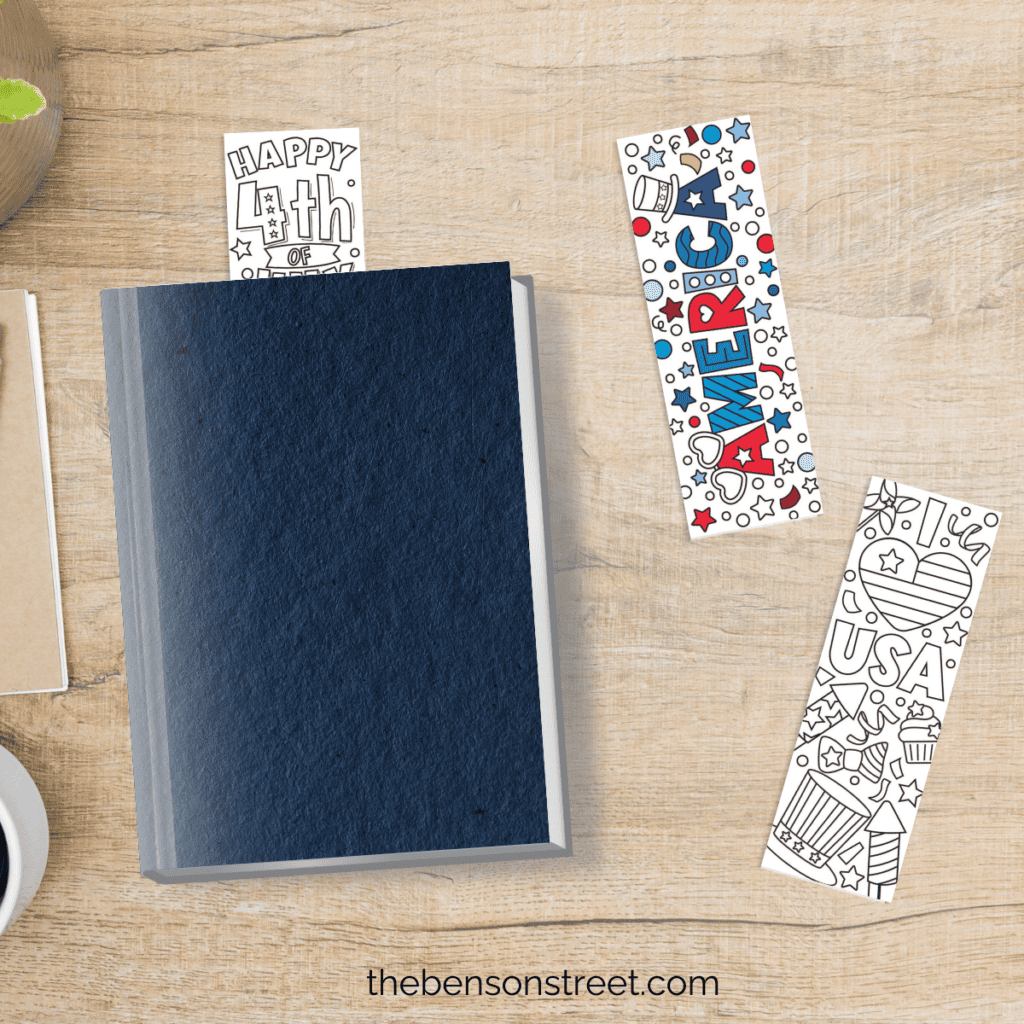 a desk with a book and fourth of july coloring bookmarks