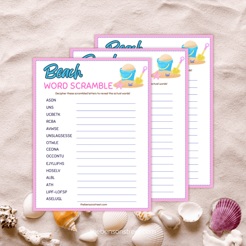 Beach word scramble printables in a stack on sand.