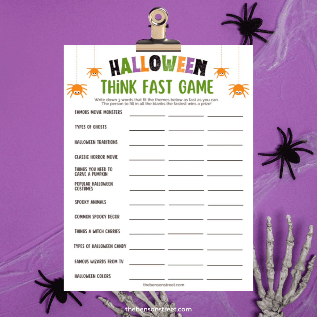 Clipboard with a halloween think fast game printable sheet on it.