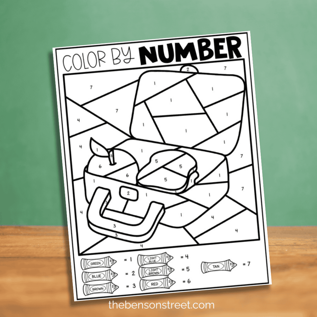 A black and white color by number worksheet for back-to-school, showing a lunchbox with numbers indicating where to color.