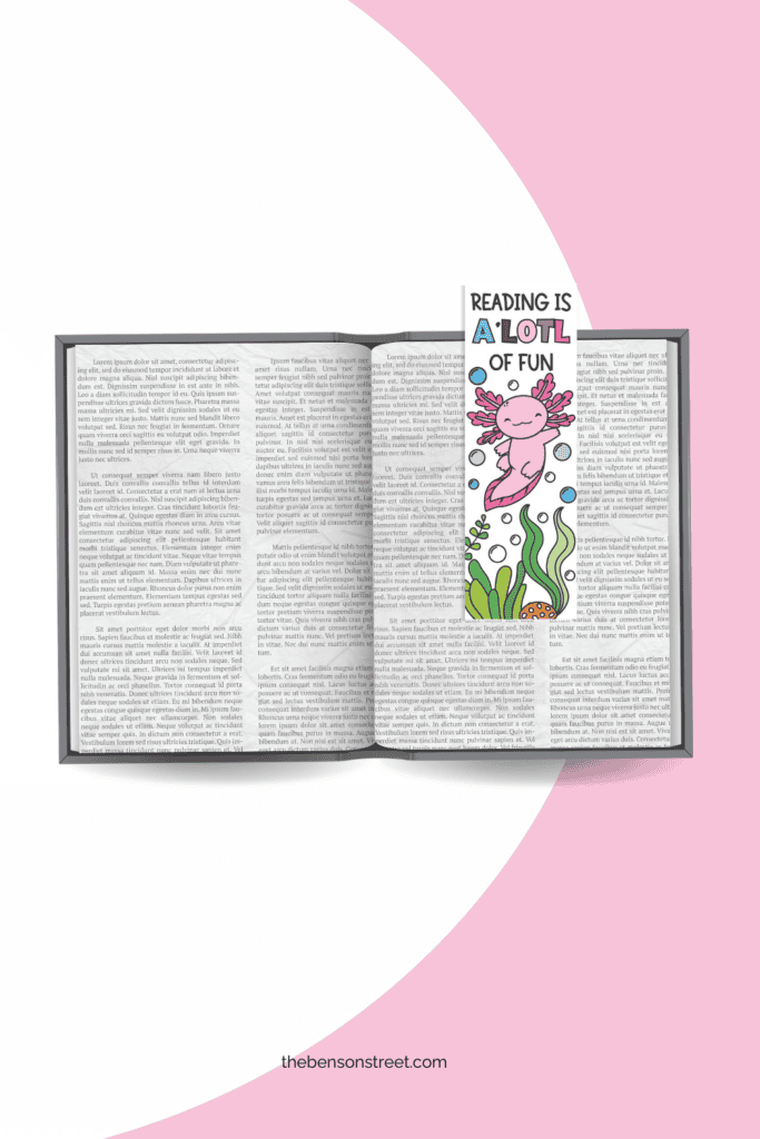 Colored in axolotl bookmark on an open book holding your page