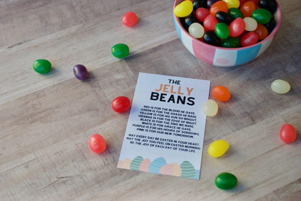 Jelly beans in a bowl and scattered around a printed poem about Jelly Beans