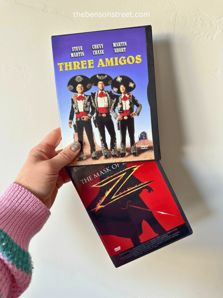 Three amigos and the mask of Zorro DVD cases held up together