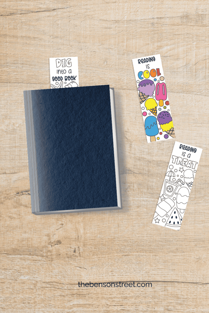 Cute and Free flat lay coloring bookmarks one in sticking out of a book and another one colored in laying by it