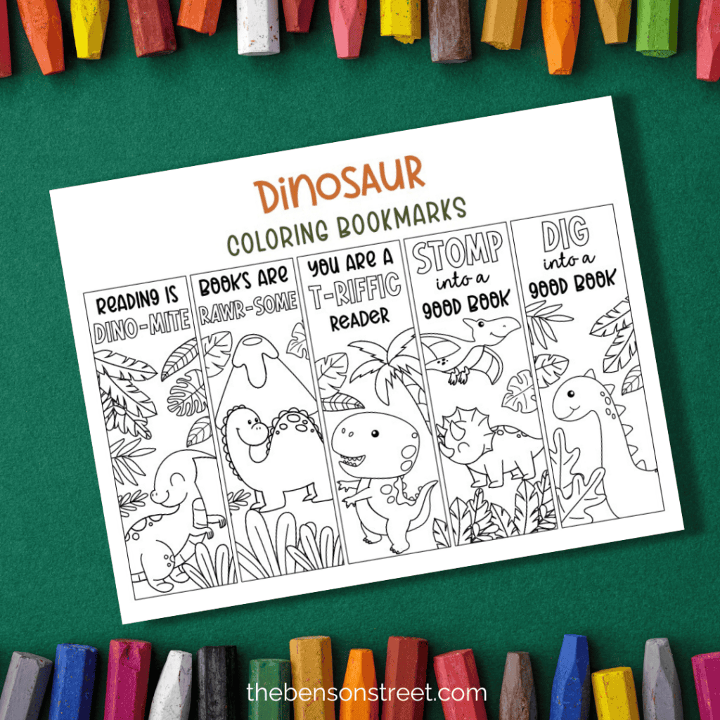 Adorable dinosaur bookmarks to color on a green background with crayons around the printed out page