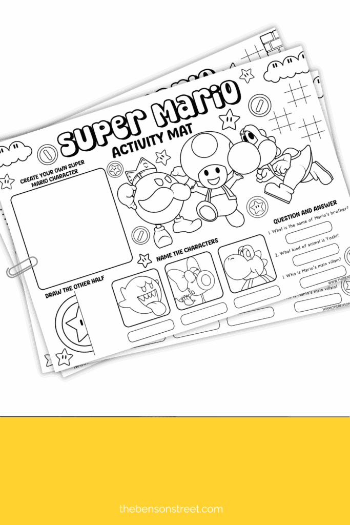 Stack of printed out super mario activity mats clipped together with a paperclip