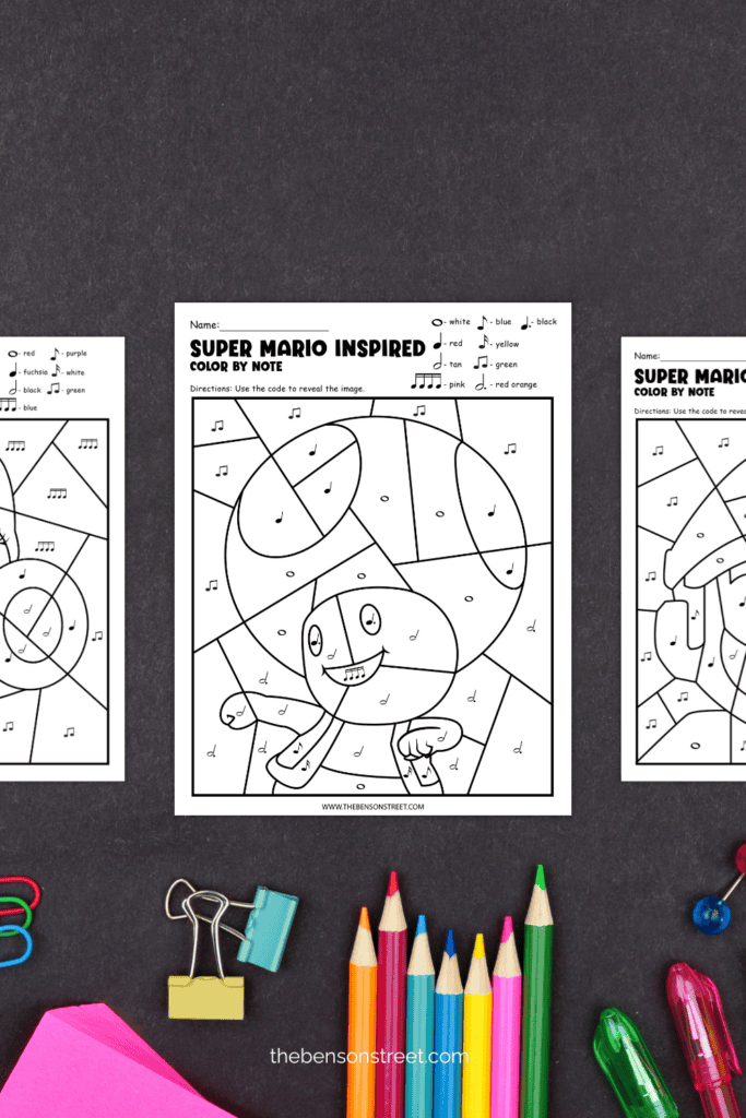 Three Mario Color by Note Pages side by side with coloring supplies on a black background
