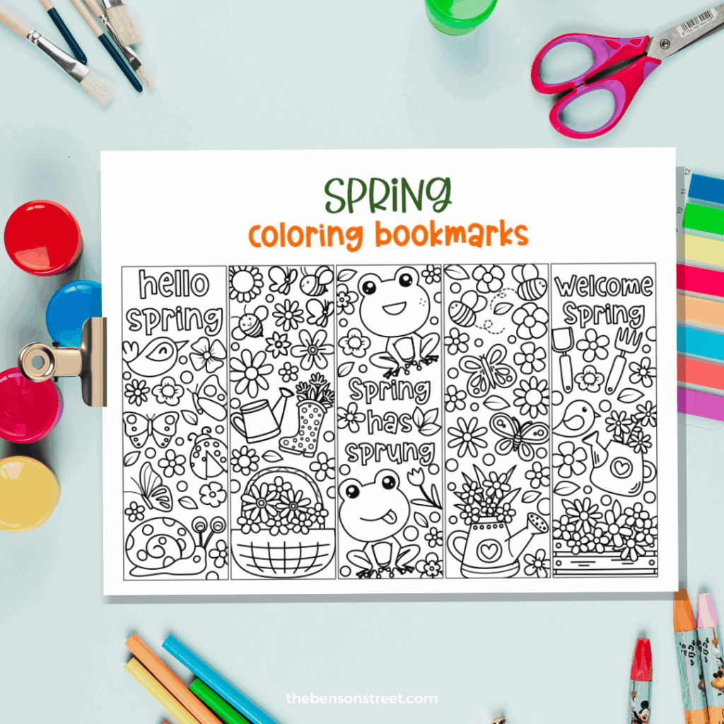 Spring coloring bookmarks with coloring supplies in the background