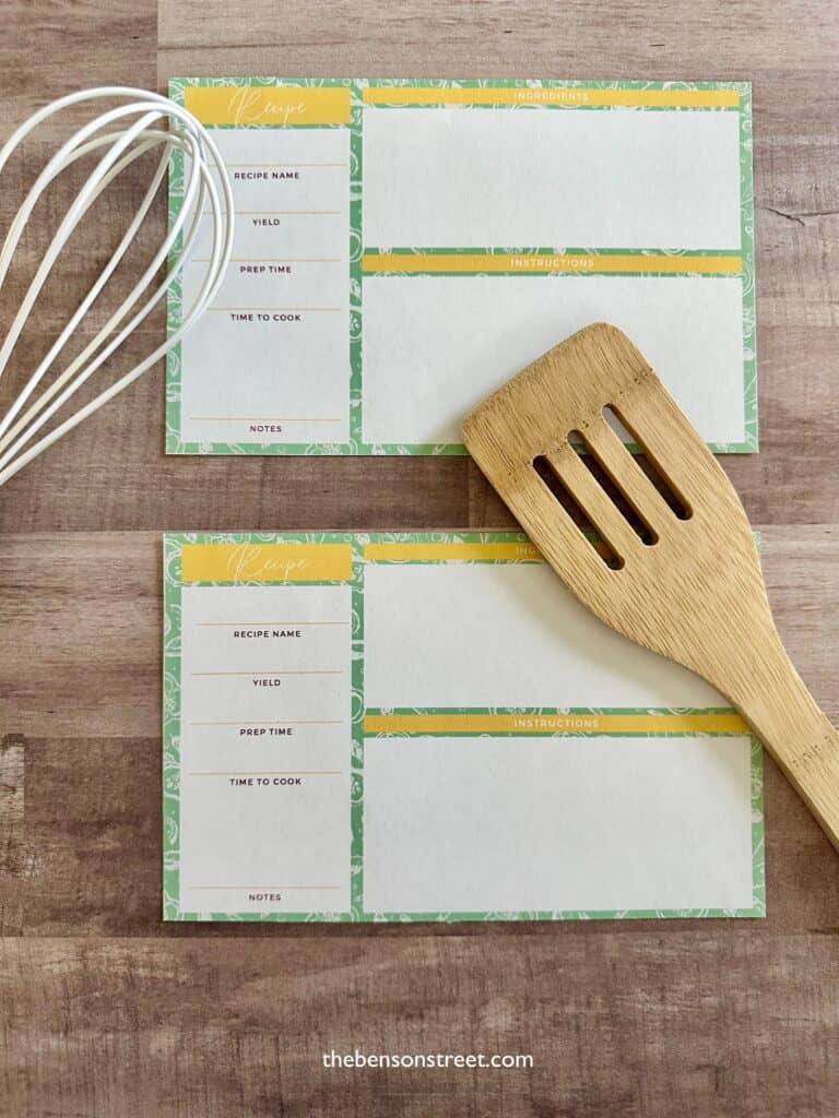 Two printable recipe cards on a wood background with a wooden spoon and whisk