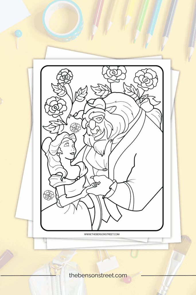 Beauty and the Beast Themed coloring page laying on top of a stack of papers