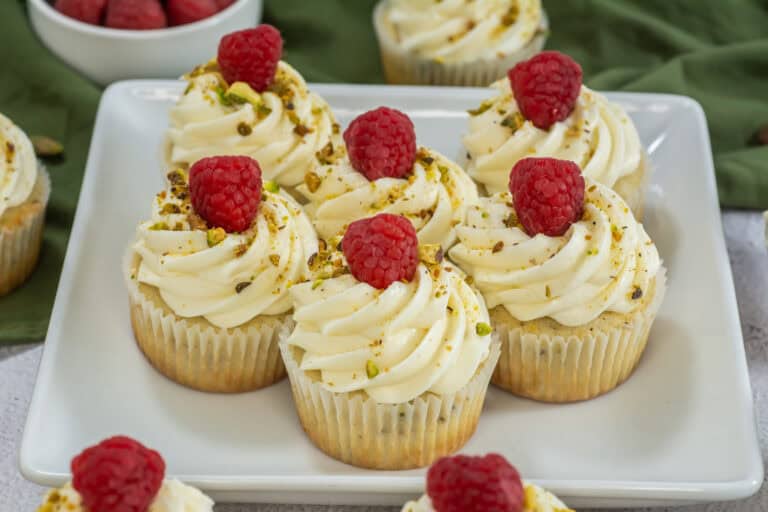 Close up shot of a plate of raspberry pistachio cupcake recipe