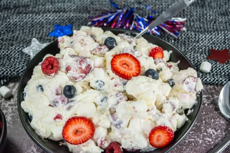 Use fresh berries, cream cheese and other delicious ingredients to make this fluffy cheesecake salad