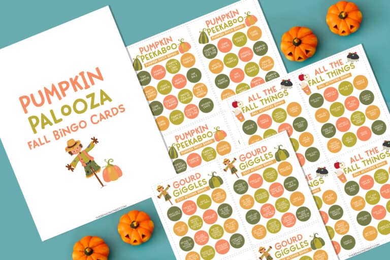 flat lay of fall activity bingo pages on a blue background