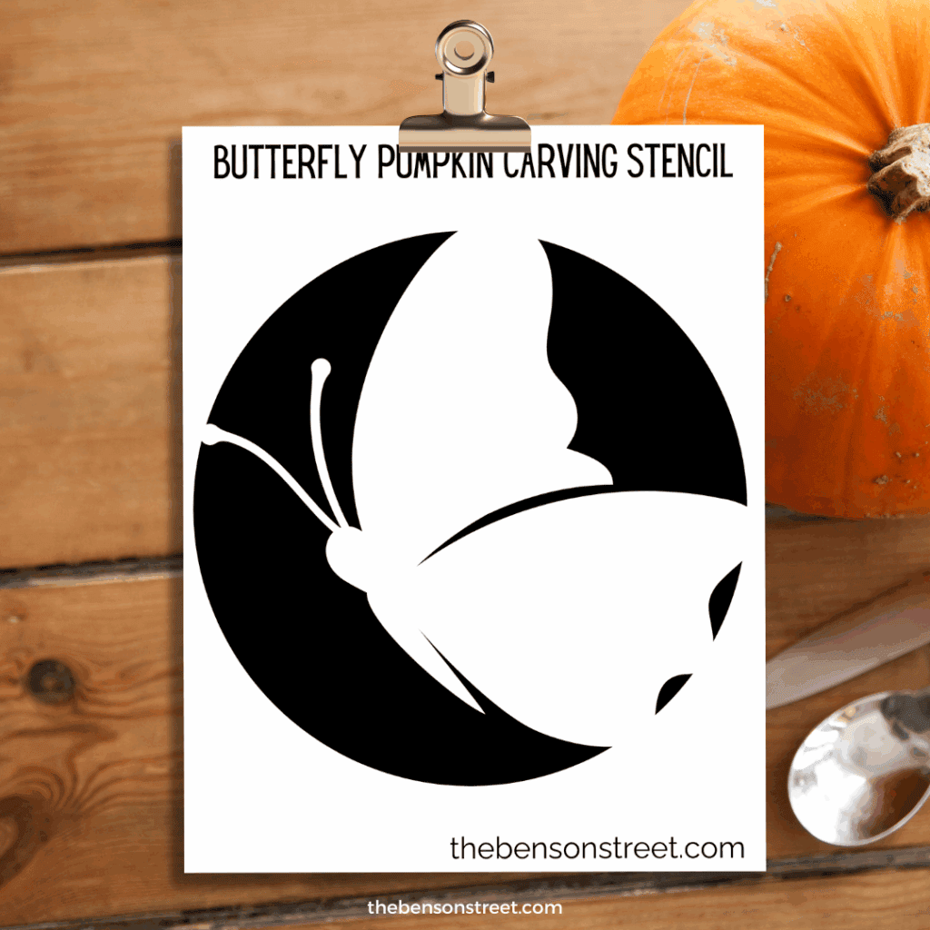 Butterfly Pumpkin Carving Stencil template on a clipboard
