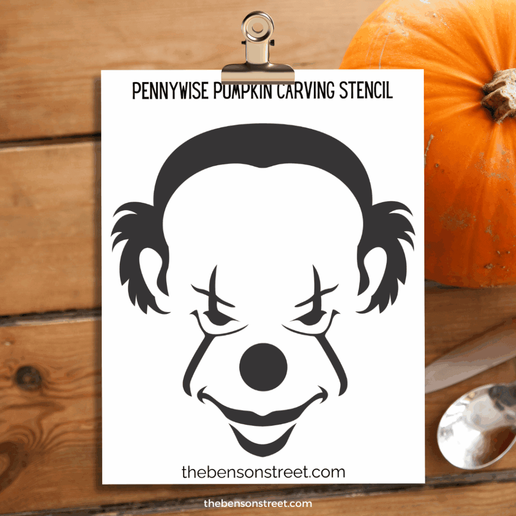 Pennywise Clown Pumpkin Carving Stencil template on a clipboard