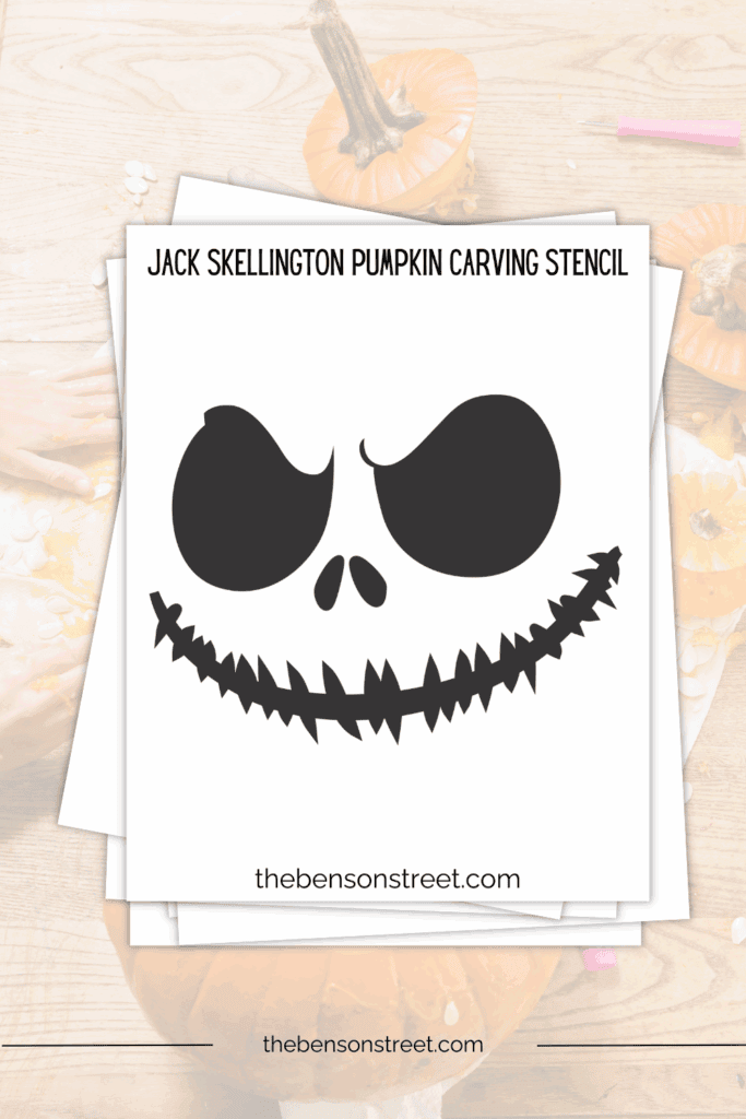 Stack of papers with a jack skellington pumpkin carving template on top