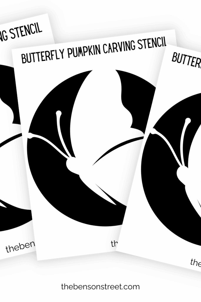 Three pages of printed out butterfly pumpkin carving stencils in a fanned out pile