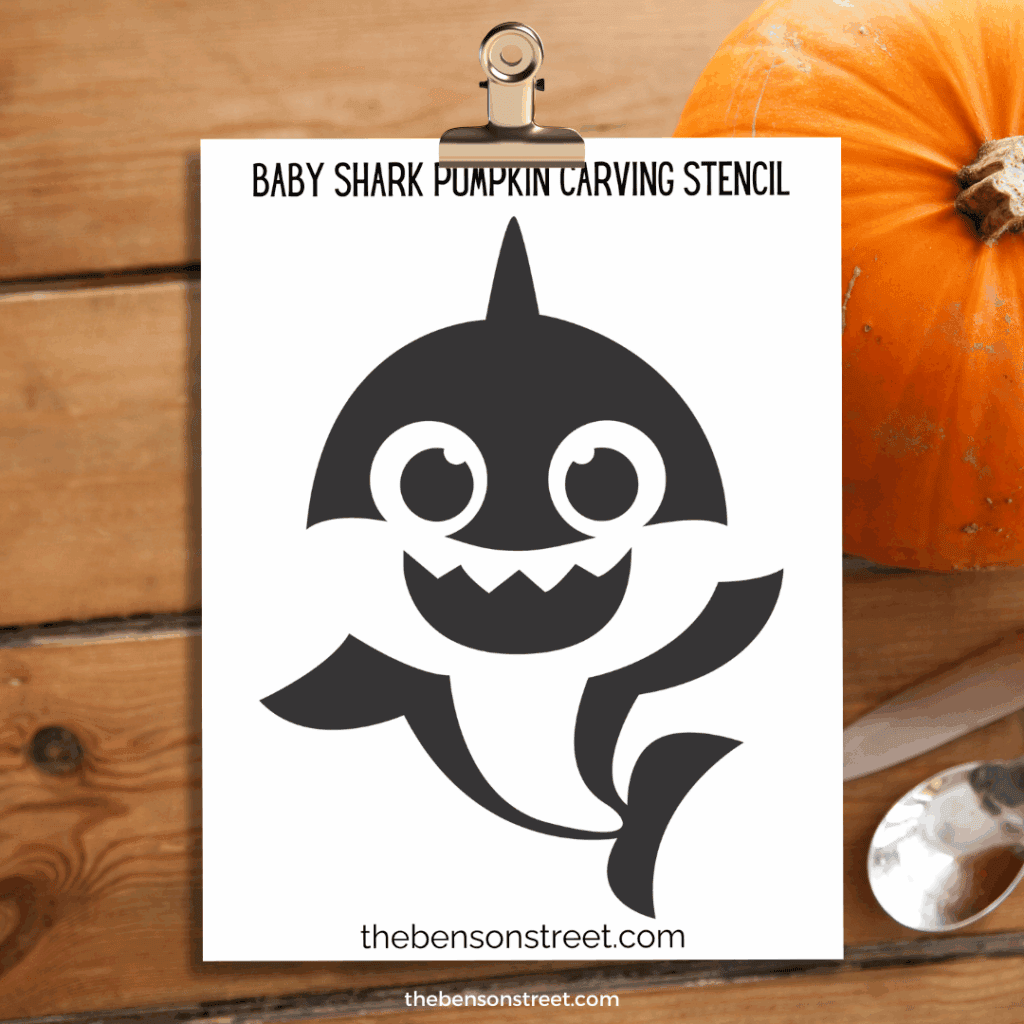 baby shark Pumpkin Carving Stencil template on a clipboard