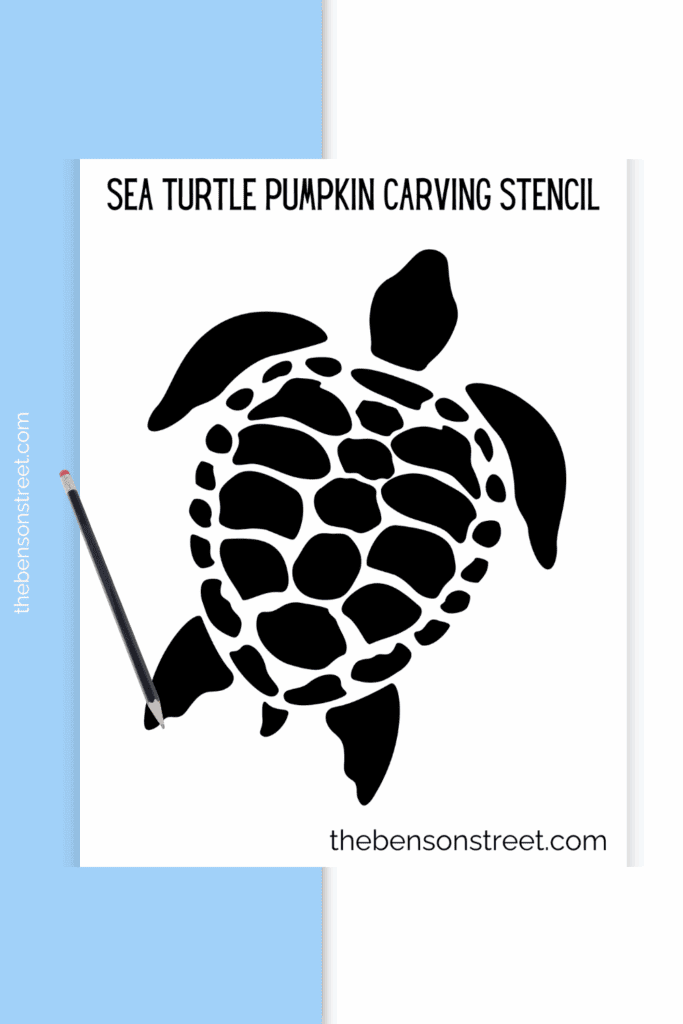 A printed out stencil for carving a turtle pumpkin with a pencil on top