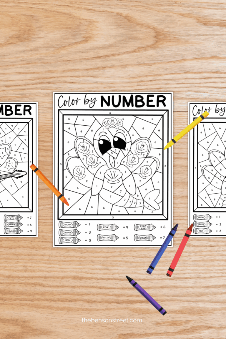 A table with sheets of color by number worksheets for Thanksgiving with crayons around