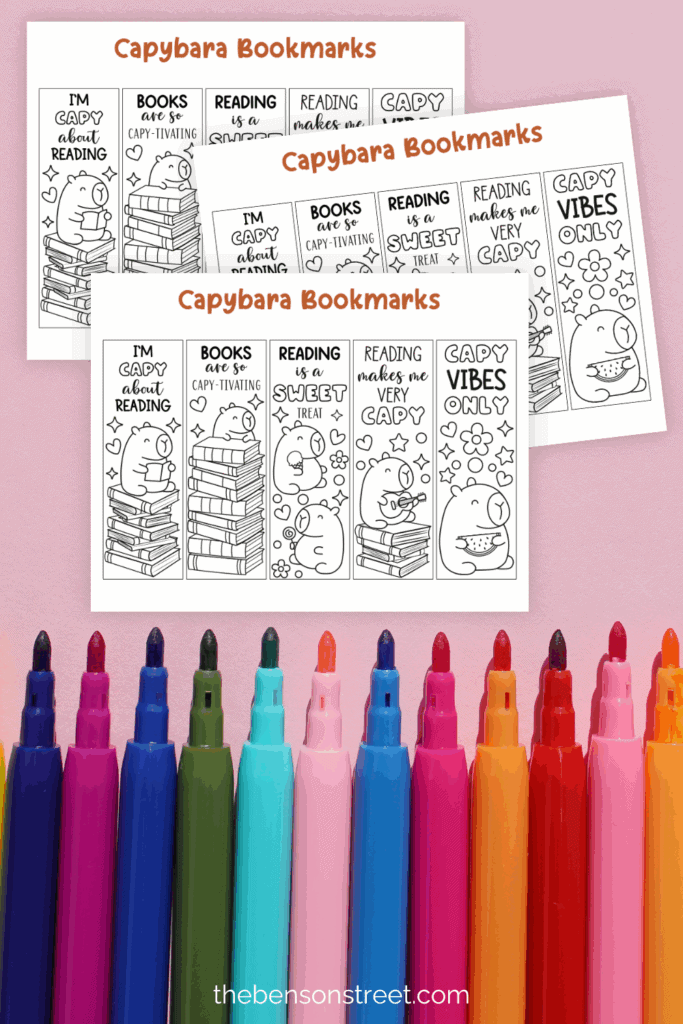 Capybara themed coloring bookmarks on a pink background with markers
