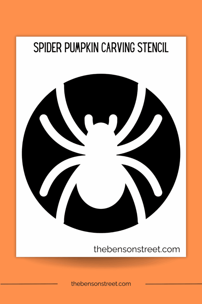 One page of a black and white stencil with a spider for pumpkin carving