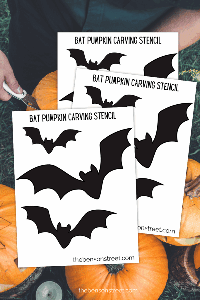 Staggered stack of papers with three flying bats on them for using as a pumpkin stencil