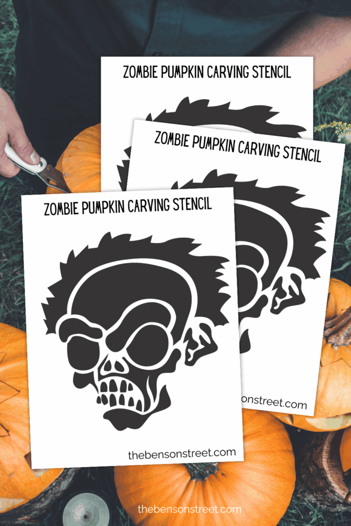 Three printed out sheets of a pumpkin carving stencil with a zombie face on them