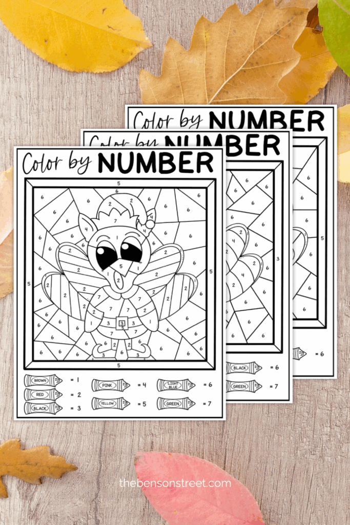 Three sheets in a staggered pile for turkey color by number pages for kids