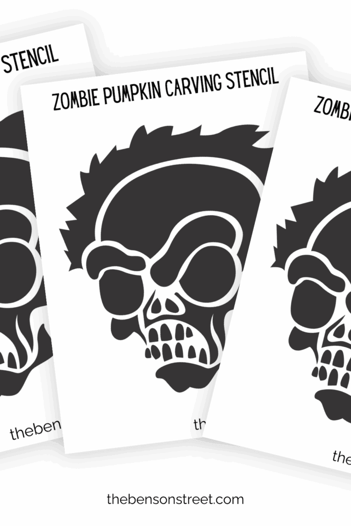 Three zombie pumpkin carving stencils in a fanned out stack.