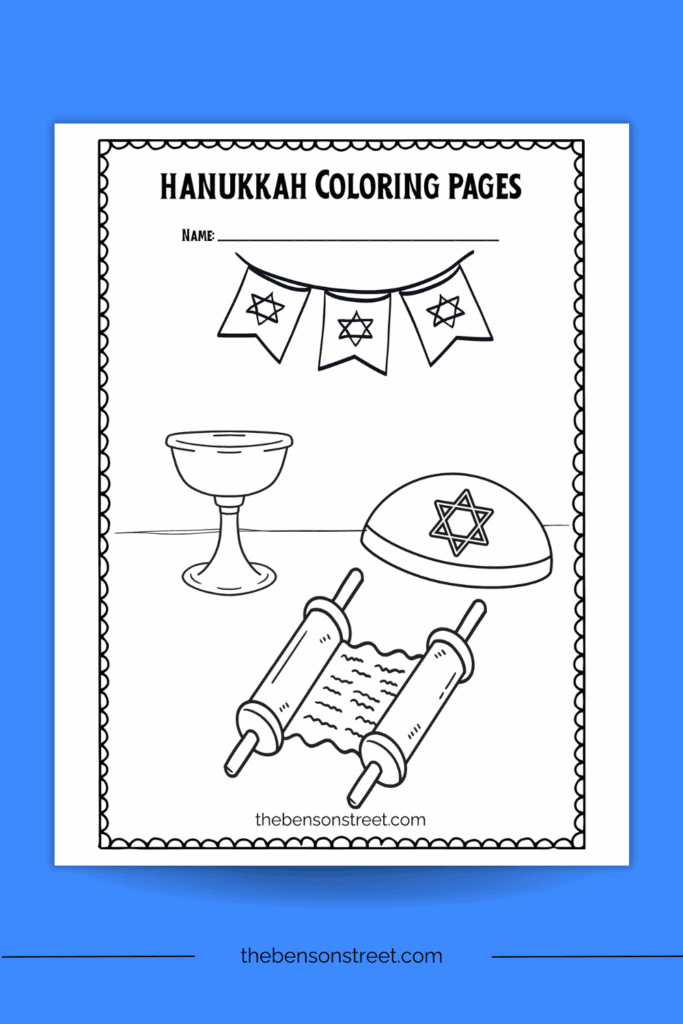 A printable coloring page with a torah scroll and kippah