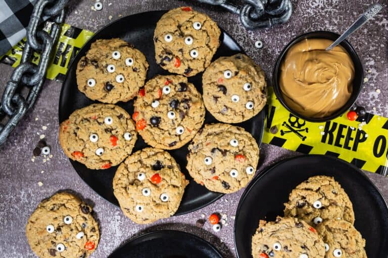 Black plate with peanut butter monster cookies on it