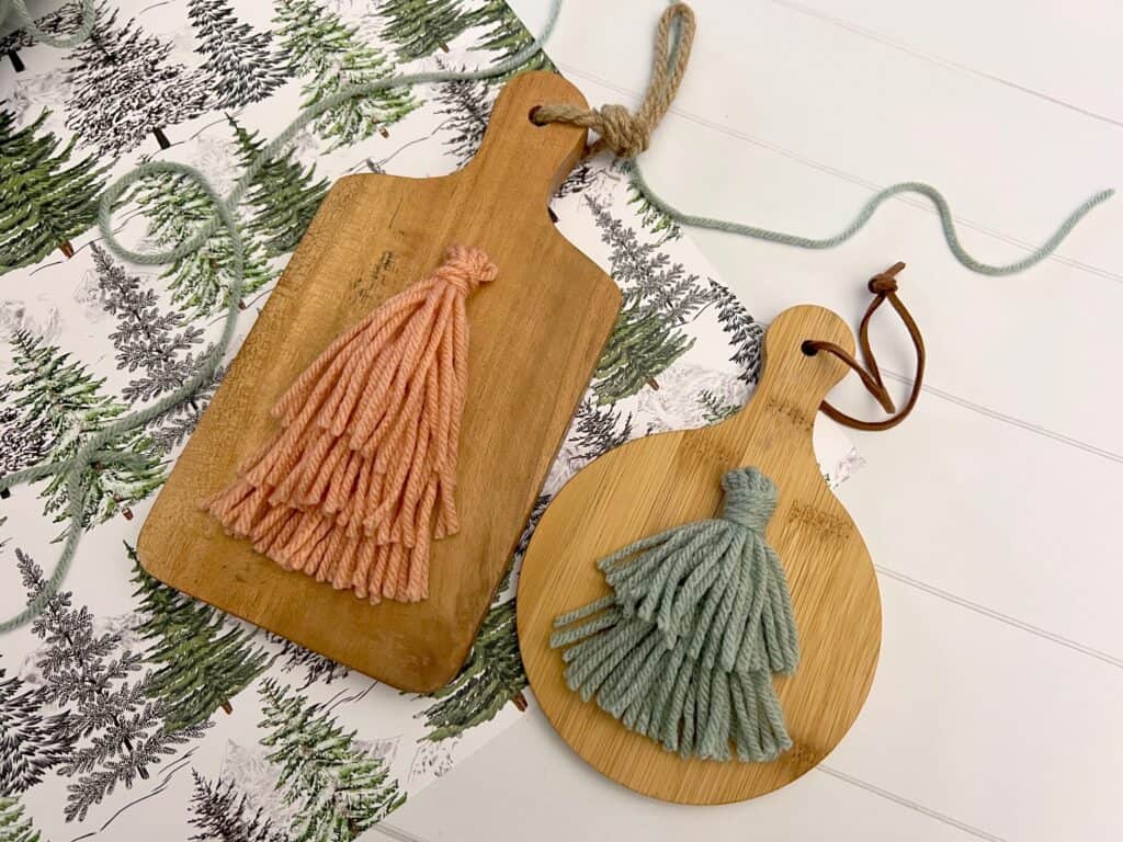 Christmas tree tassel ornaments on mini wood cutting boards
