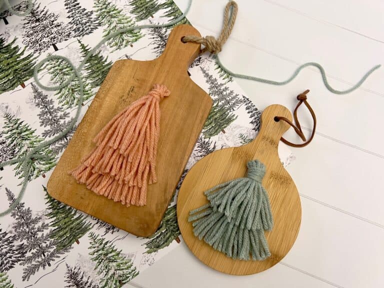 Christmas tree tassel ornaments on mini wood cutting boards
