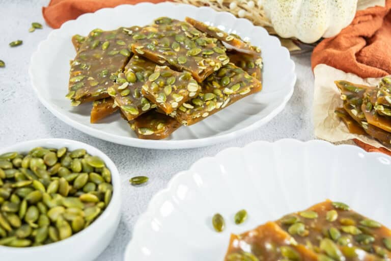 Delicious toasted pepitas candy brittle on a white plate