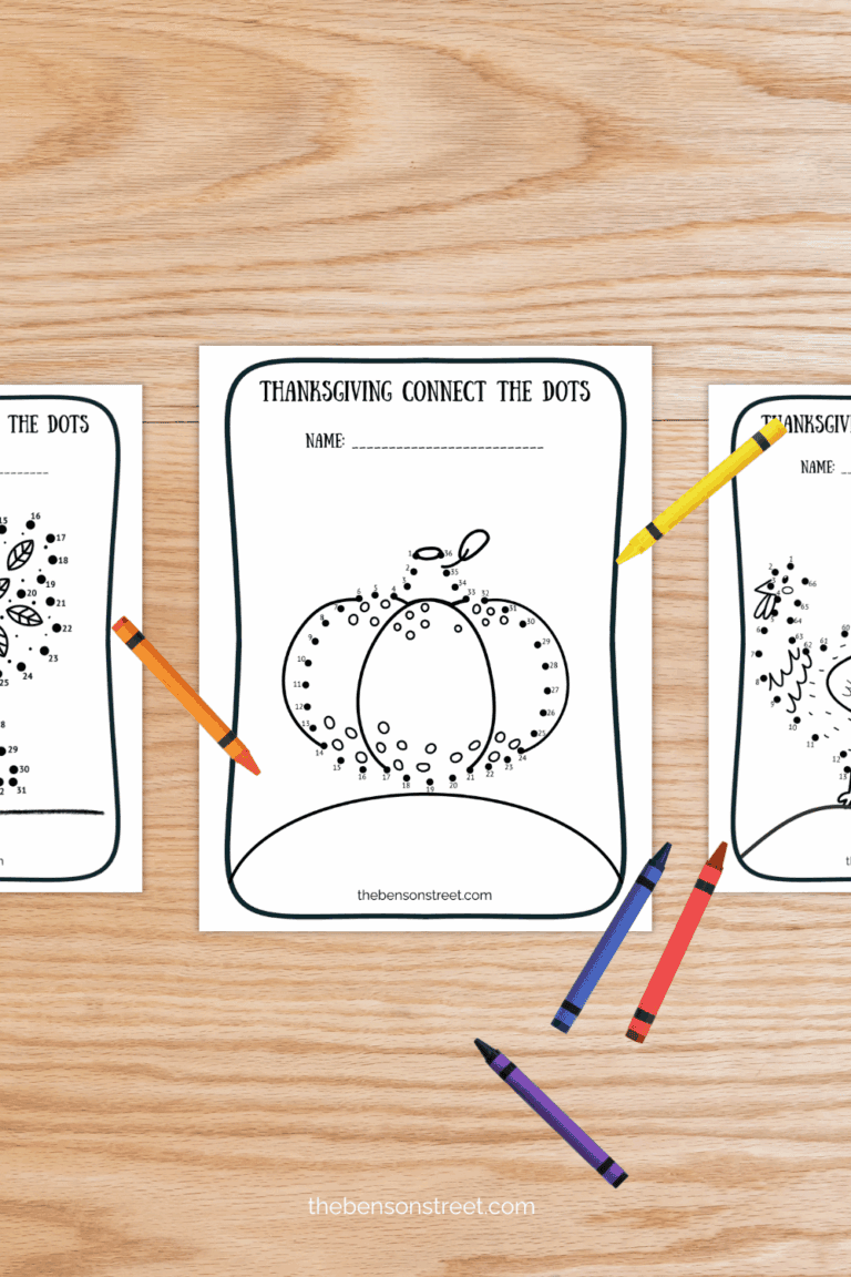 Three coloring pages for thanksgiving on a table with crayons scattered around