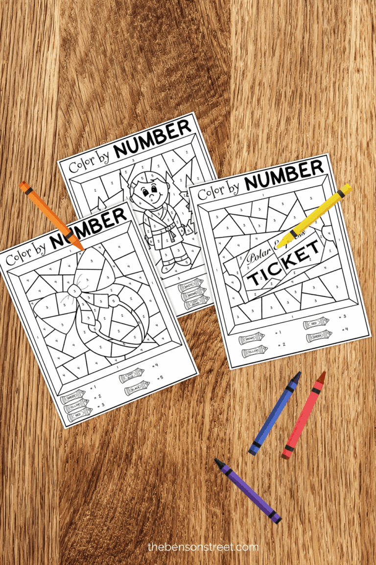 Three sheets of color by number pages with crayons around