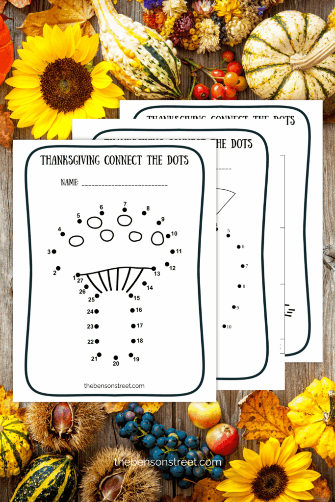 Three sheets printed out with connect the dots coloring pages on a thanksgiving background