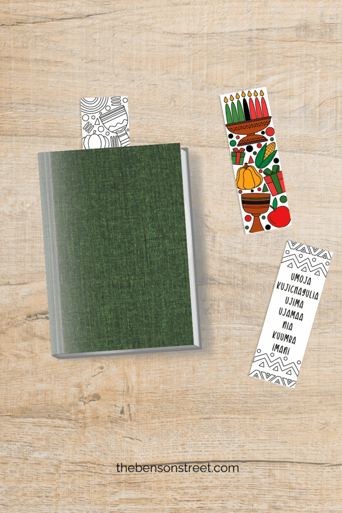 A book with a bookmark sticking out of it and two coloring printable ones laying next to it