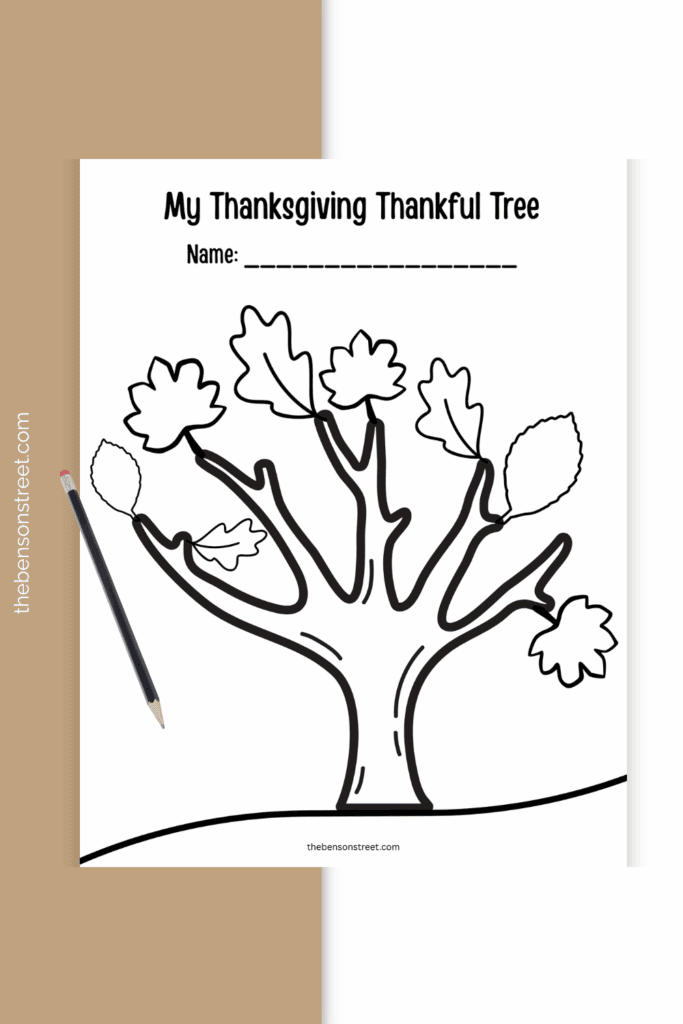 A printed out sheet of thanksgiving thankful tree with a pencil on top of the sheet