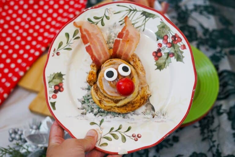 A reindeer cinnamon roll on a plate