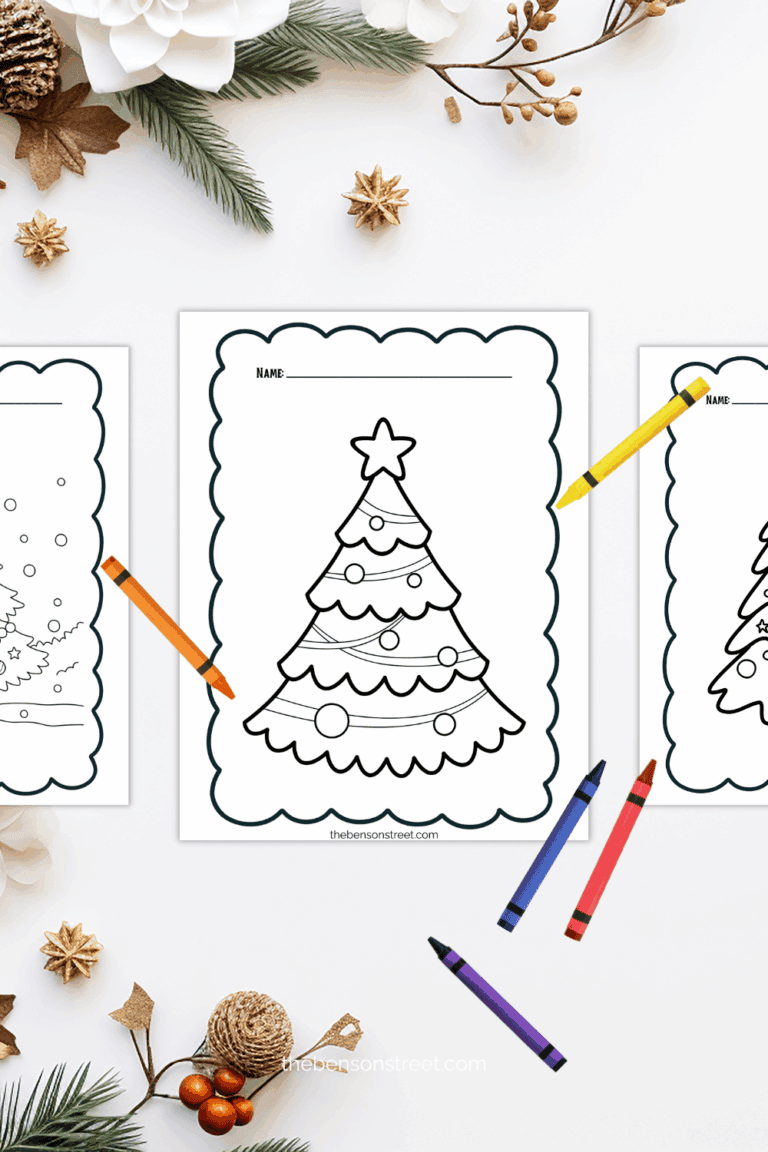 Three christmas coloring sheets with crayons laying around