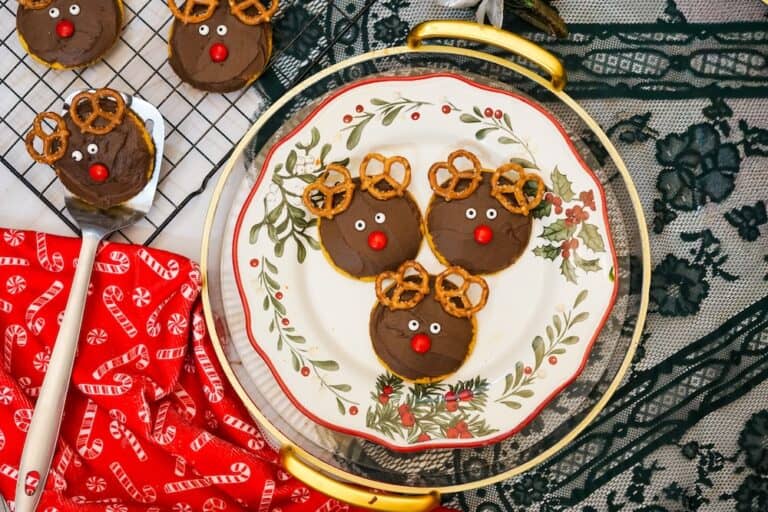 Up close sugar cookies frosted with chocolate frosting and decorated like reindeer